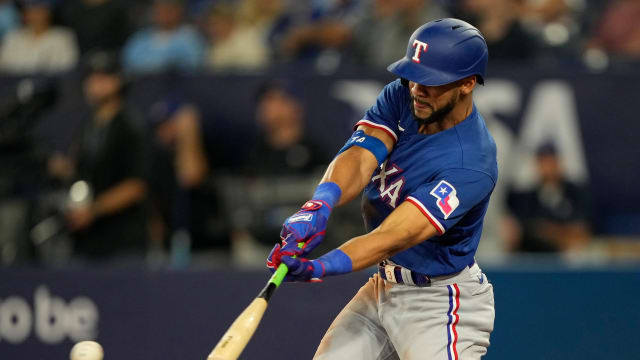Sep 11, 2023; Toronto, Ontario, CAN; Texas Rangers center fielder Leody Taveras (3) hits a single against the Toronto Blue Jays during the sixth inning at Rogers Centre. Mandatory Credit: John E. Sokolowski-USA TODAY Sports  